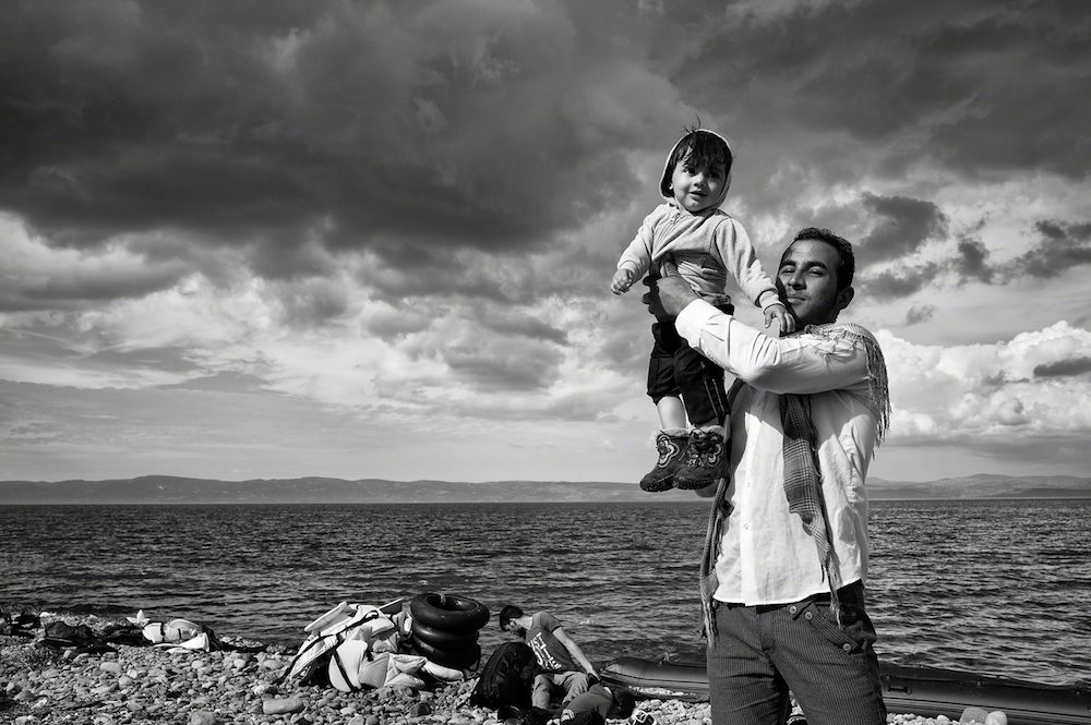 http://www.laobserved.com/intell/assets/father-daughter-reach-lesbos-stoddart.jpg