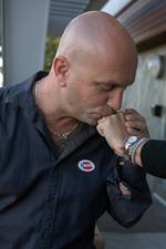 bruce-kisses-ring.jpg